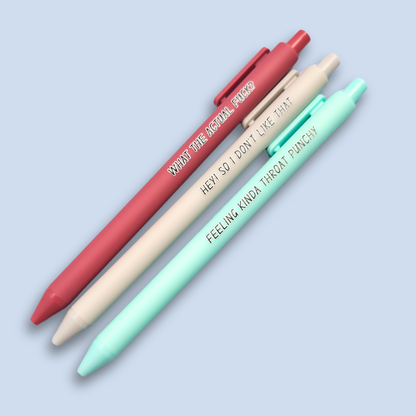 Three pens with sayings on them. "What the actual fuck?."(dust pink pen), "Hey! So I don't like that" (Light grey pen), "Feeling kinda throat punchy" ( mint pen).