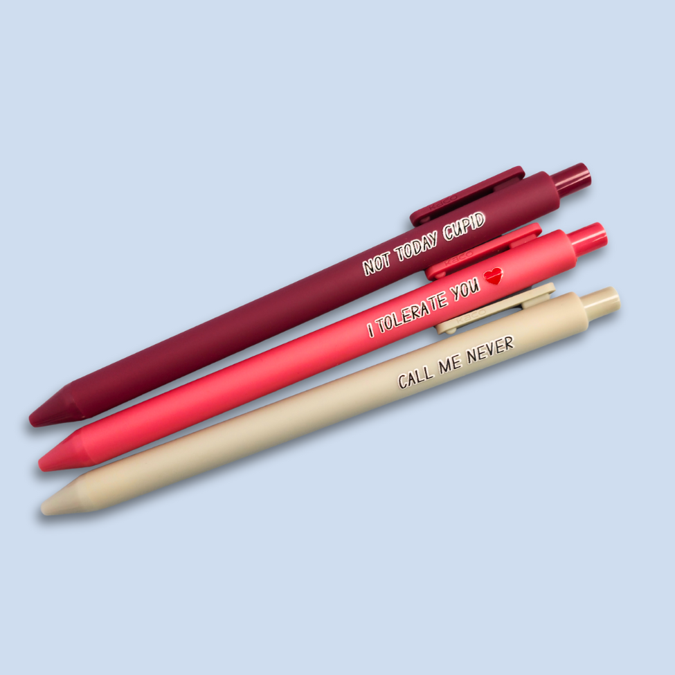 Three pens with text on a light blue background