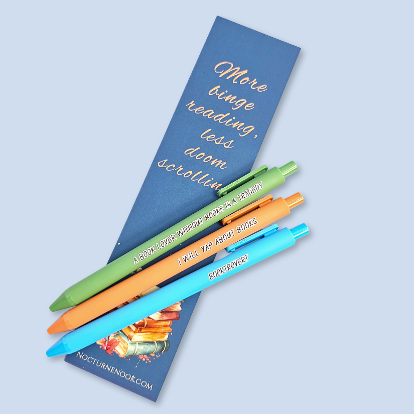 Colorful pens on a blue background with a bookmark