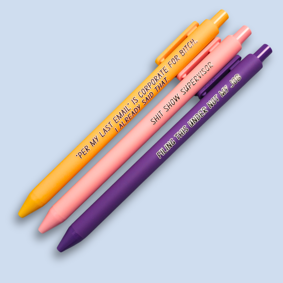 Three pens with sayings on them. "Per My Last Email" is Corporate for bitch, I already said that."(bright yellow pen), "Shit show supervisor" (pastel Pink pen), "Filing this under not my job" ( purple pen).