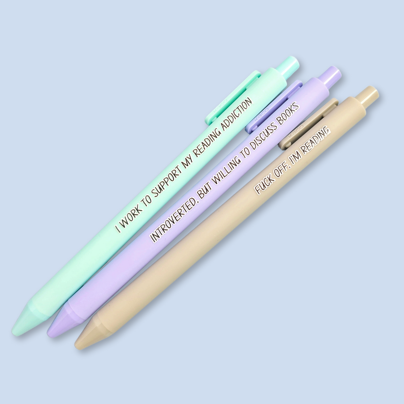 Three pens with humorous text on a light blue background