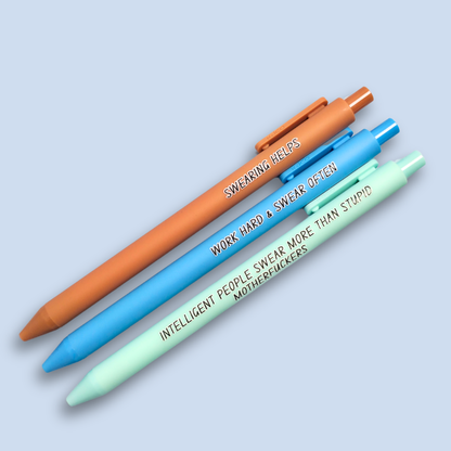 Three pens with sayings on them. "Swearing Helps"(Caramel  pen), "Work Hard & Swear often" (bright blue pen), "Intelligent people swear more than stupid motherfuckers" ( mint pen)
