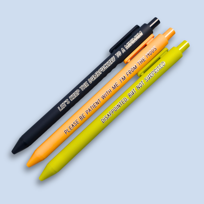 Three pens with humorous text on a light blue background