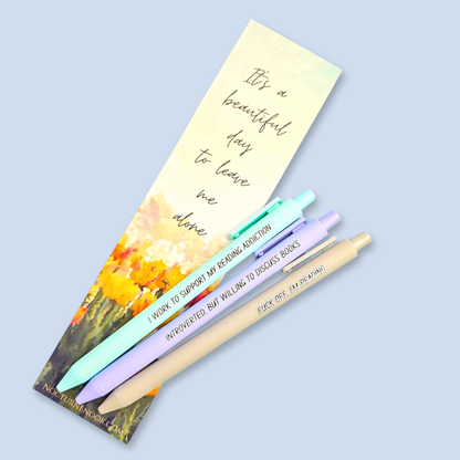 Three pens with humorous text on a light blue background