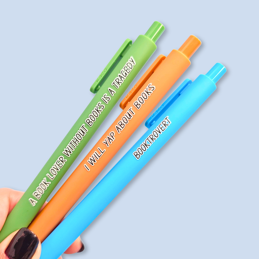 Three colorful pens with text on a light blue background