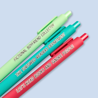 Three pens with sayings on them. "Fictional Boyfriend Collector"(light green pen), "The Tortured Readers Department" (teal pen), "Let's read books and ignore people" ( salmon pink pen).