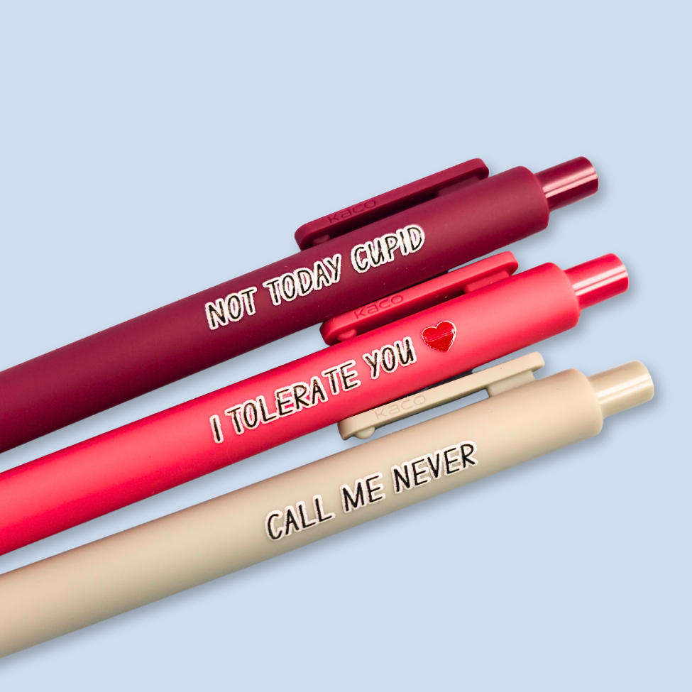 Three pens with humorous text on a light blue background