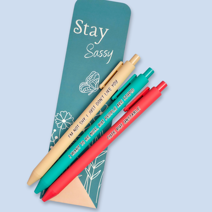 Three pens with sayings on them. "I'm not shy, I just don't like you"(linen pen), "I want to be nice, but people are stupid" (teal pen), "Cute but unstable" ( salmon pink pen).