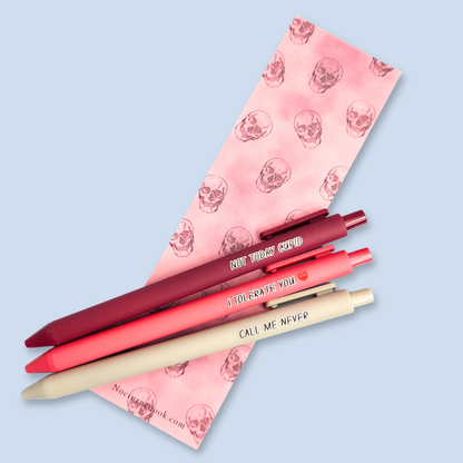 Three pens with text on a light blue background