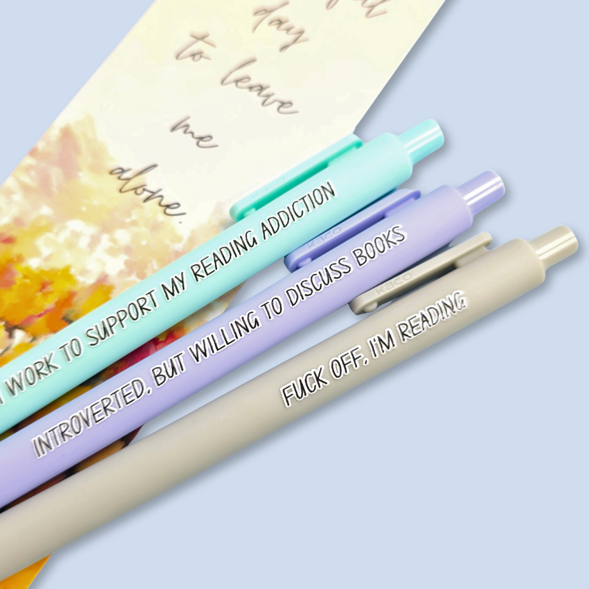 Three pens with humorous text on a light blue background