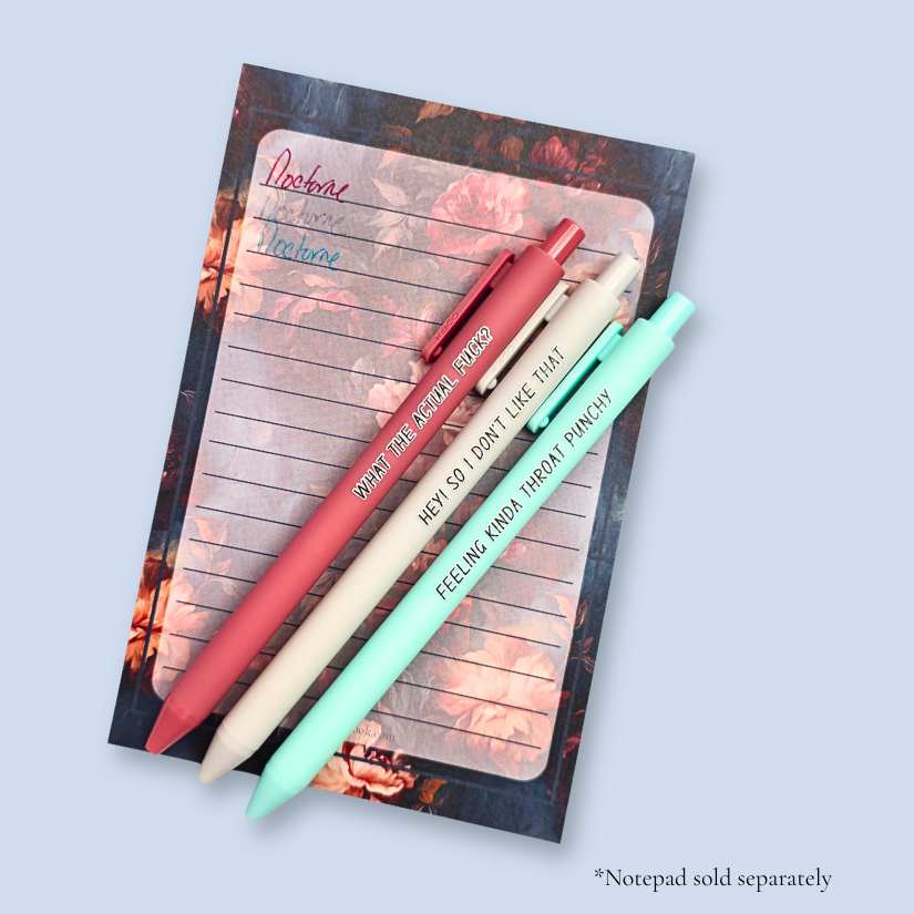 Three pens with sayings on them. "What the actual fuck?."(dust pink pen), "Hey! So I don't like that" (Light grey pen), "Feeling kinda throat punchy" ( mint pen).