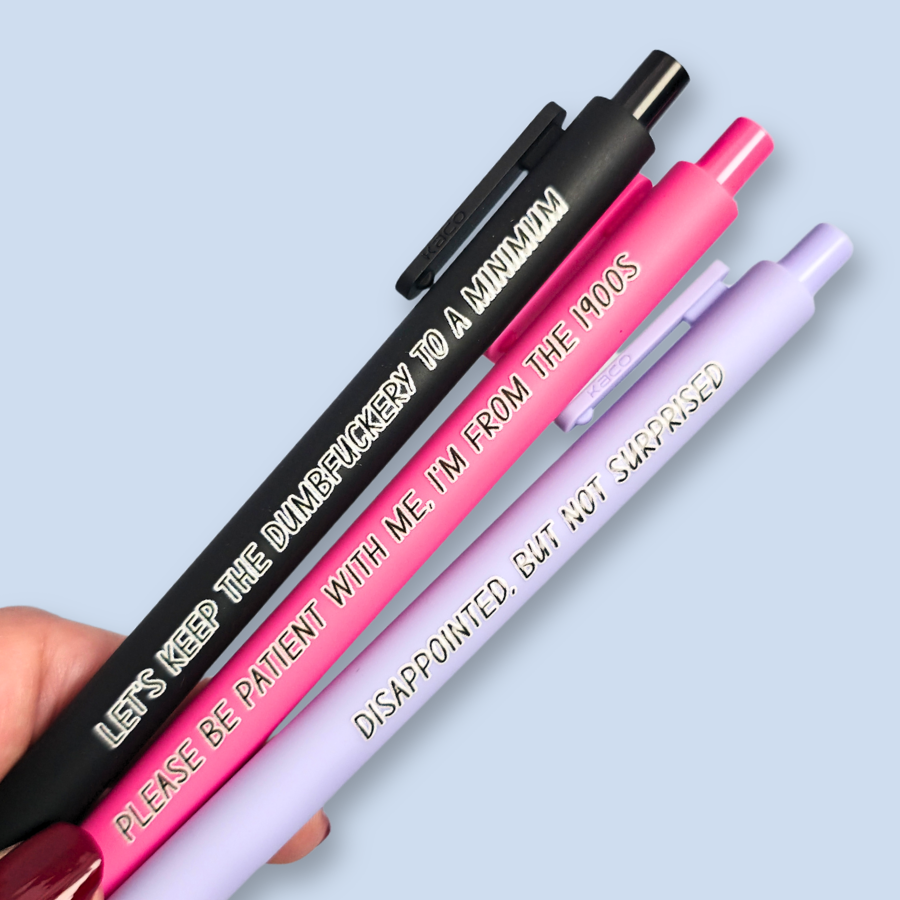 Three pens with humorous text on a light blue background