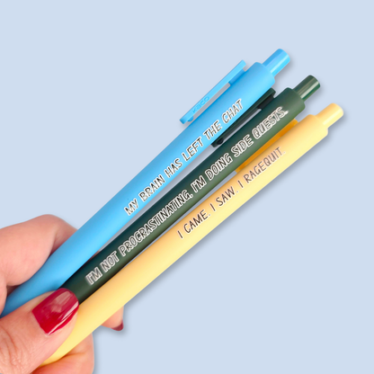 Three pens with humorous text on a light blue background