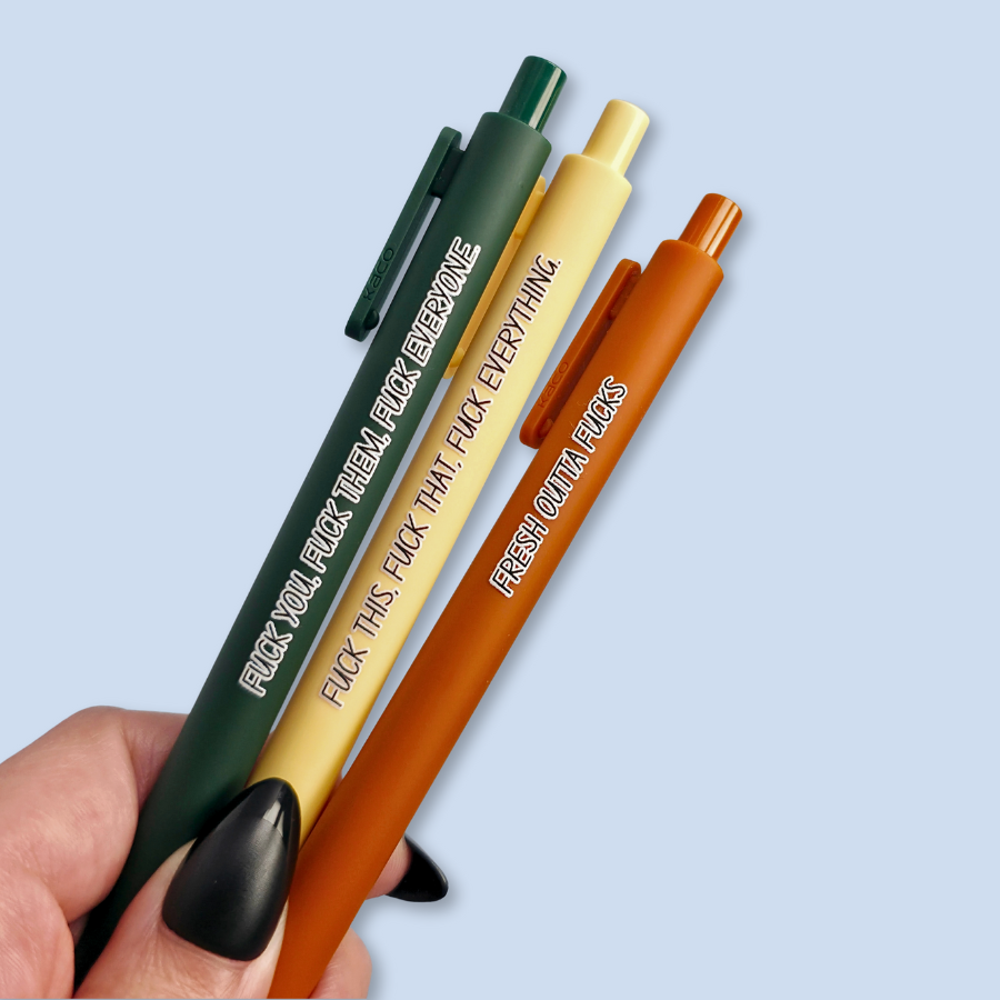 Three pens with sweary text. They read: "Fresh outta fucks" on a siennapurple pen, "Fuck you, fuck them, fuck everyone" on a forest green pen, and " fuck this, fuck that, fuck everything" on a pastel yellow pen