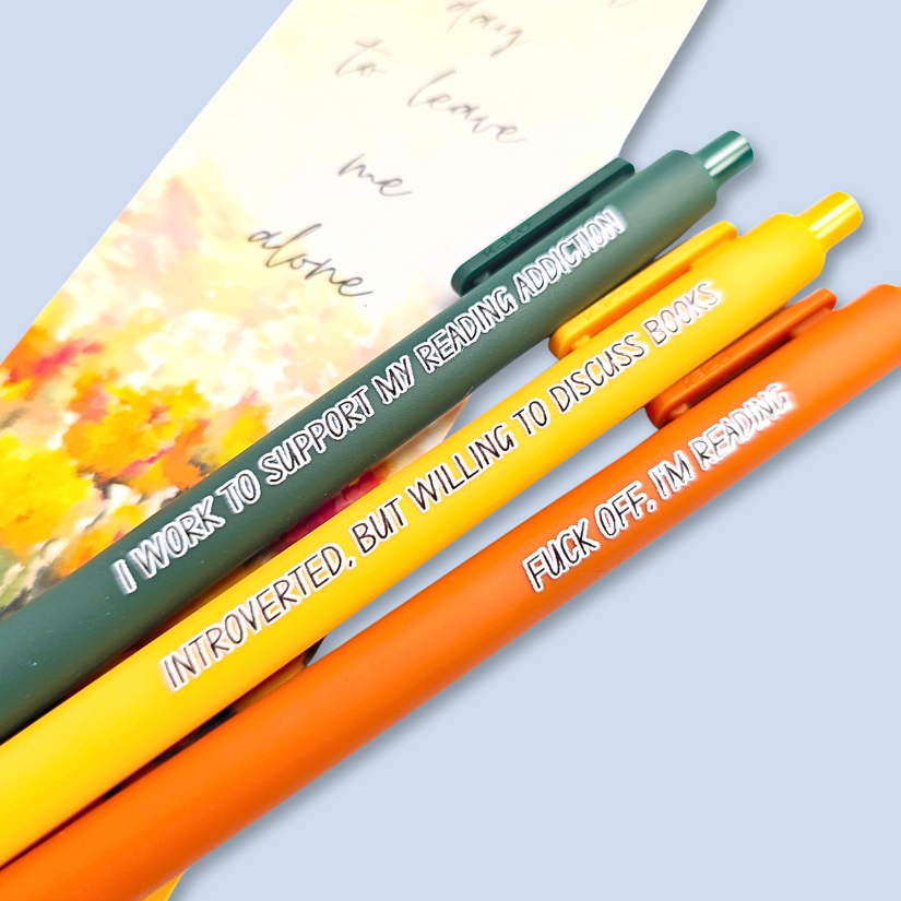 Three pens with humorous text on a light blue background