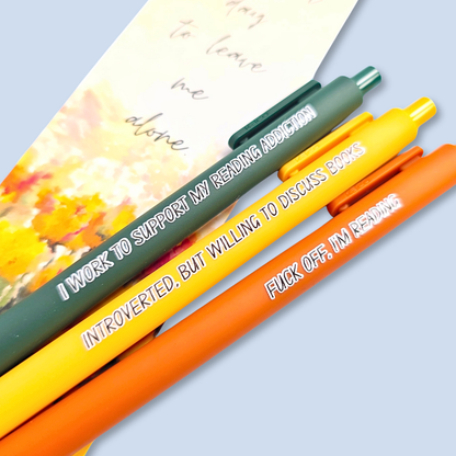 Three pens with humorous text on a light blue background