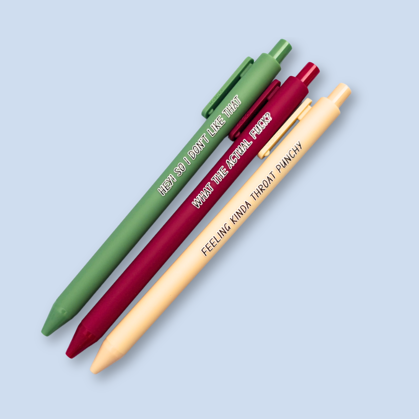 Three pens with sayings on them. "What the actual fuck?."(wine pen), "Hey! So I don't like that" (moss green pen), "Feeling kinda throat punchy" ( linen pen).