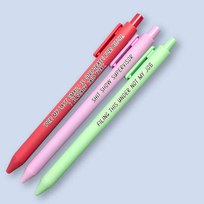 Three pens with sayings on them. "Per My Last Email" is Corporate for bitch, I already said that."(salmon pink pen), "Shit show supervisor" (lilac pen), "Filing this under not my job" ( pastel green pen).