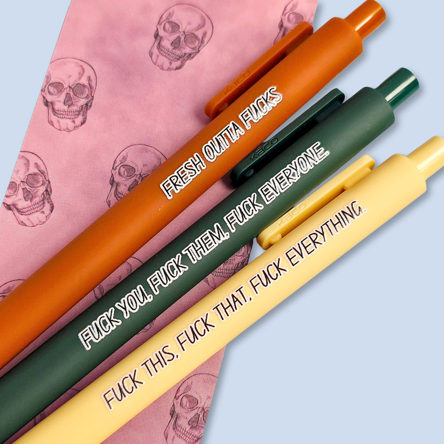 Three pens with sweary text. They read: "Fresh outta fucks" on a siennapurple pen, "Fuck you, fuck them, fuck everyone" on a forest green pen, and " fuck this, fuck that, fuck everything" on a pastel yellow pen