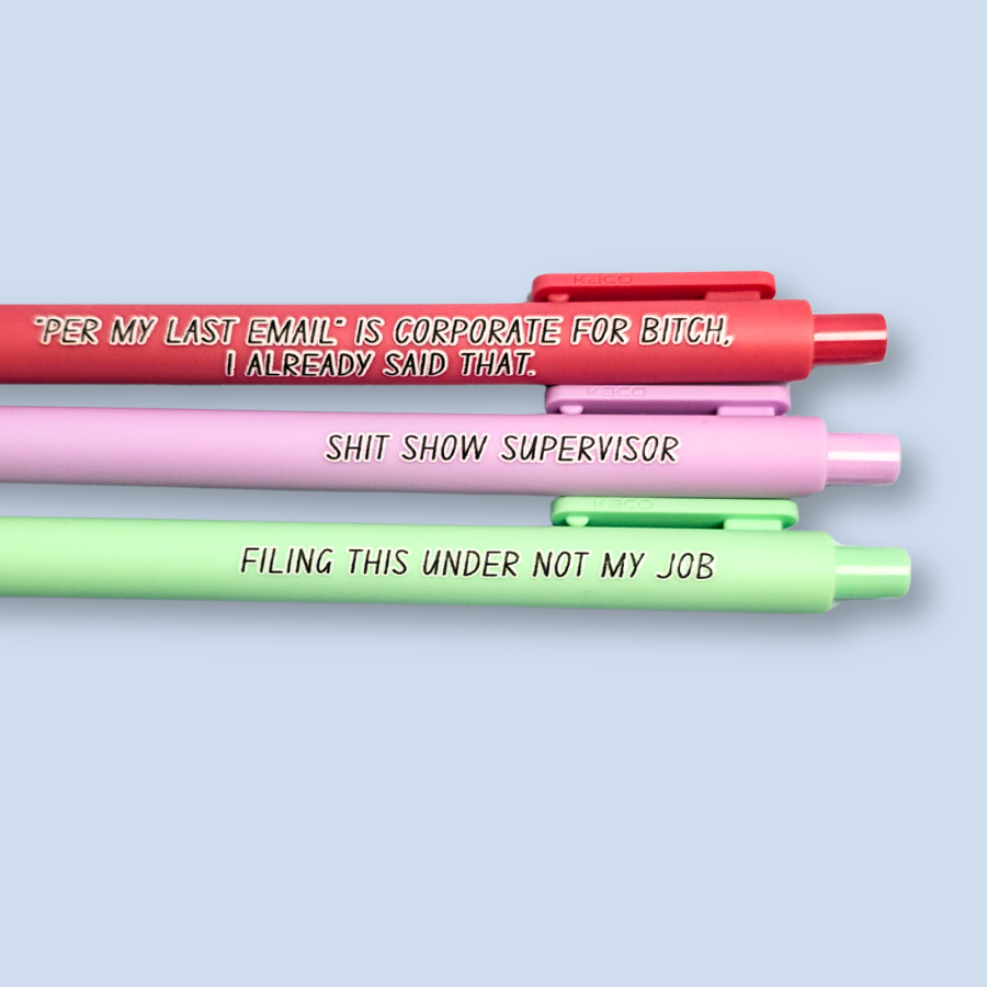 Three pens with sayings on them. "Per My Last Email" is Corporate for bitch, I already said that."(salmon pink pen), "Shit show supervisor" (lilac pen), "Filing this under not my job" ( pastel green pen).