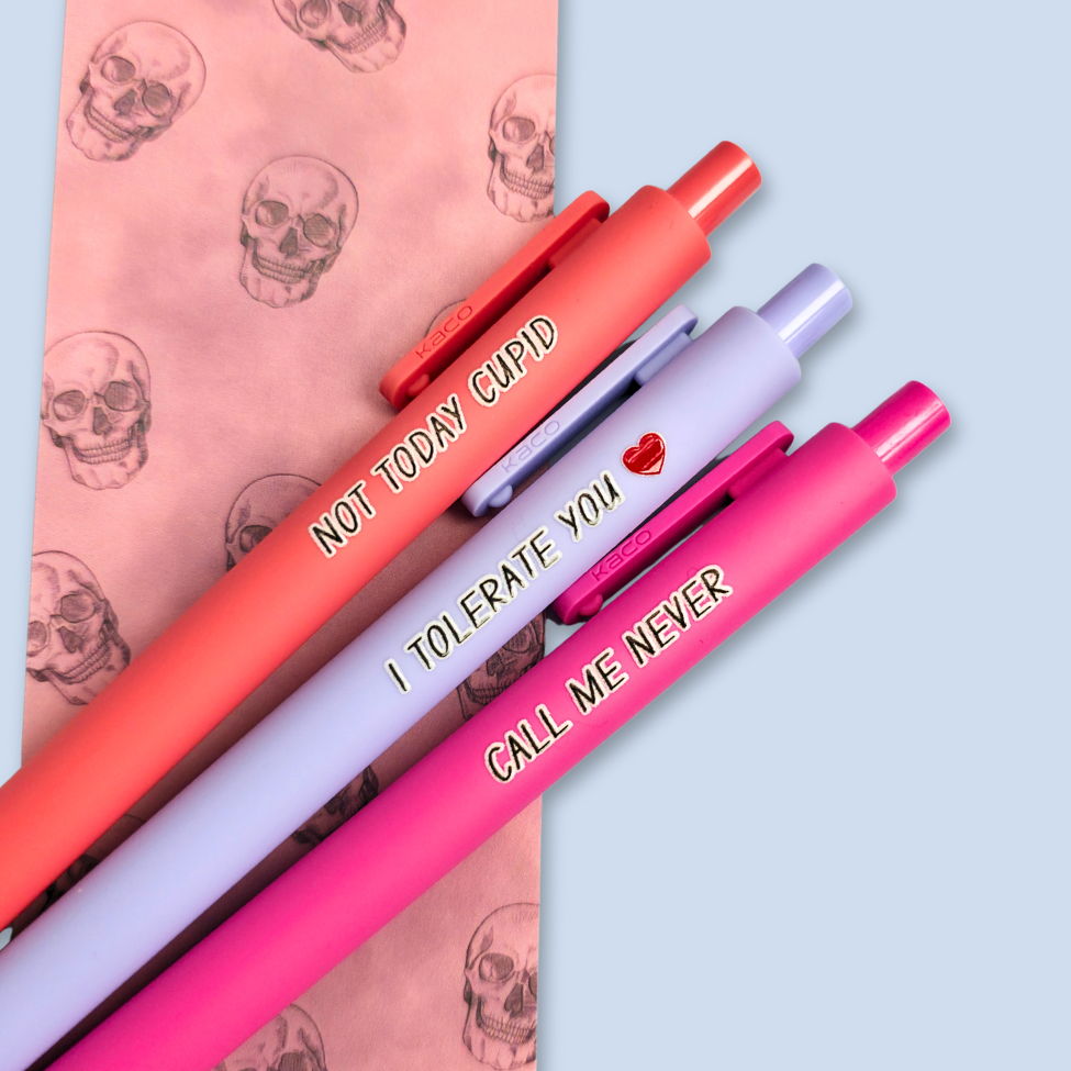 Three pens with text on a light blue background