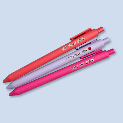 Three pens with text on a light blue background