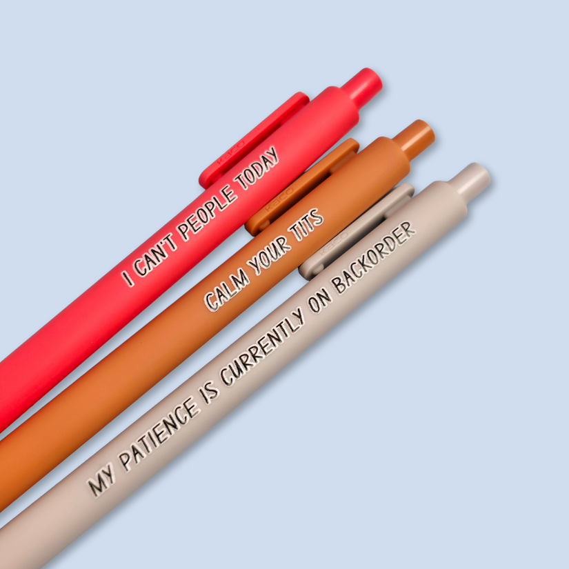 Three pens with humorous text on a light blue background
