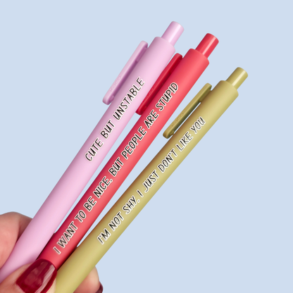 Three pens with sayings on them. "I'm not shy, I just don't like you"(olive green pen), "I want to be nice, but people are stupid" (salmon Pink pen), "Cute but unstable" ( lilac pen).
