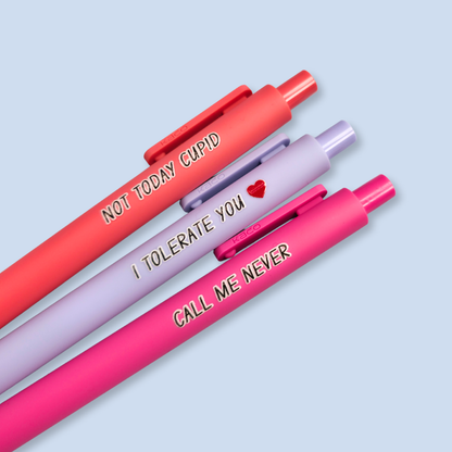Three pens with text on a light blue background